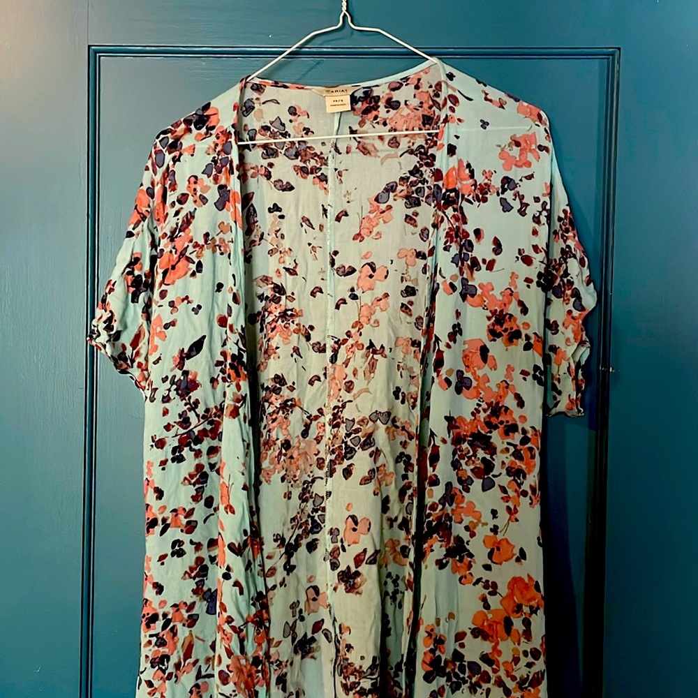 Open shawl, longer in front with detailed bottom.